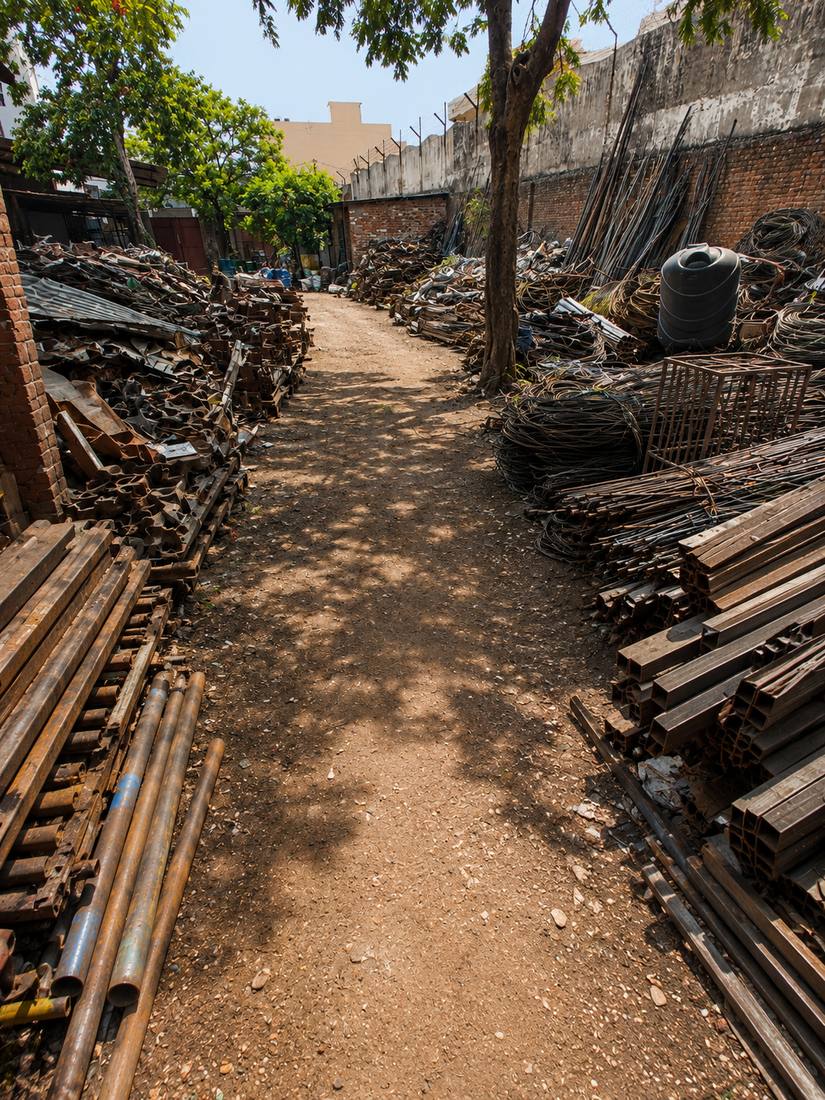 Structural steel scrap and drums stored at Bahl Metals yard