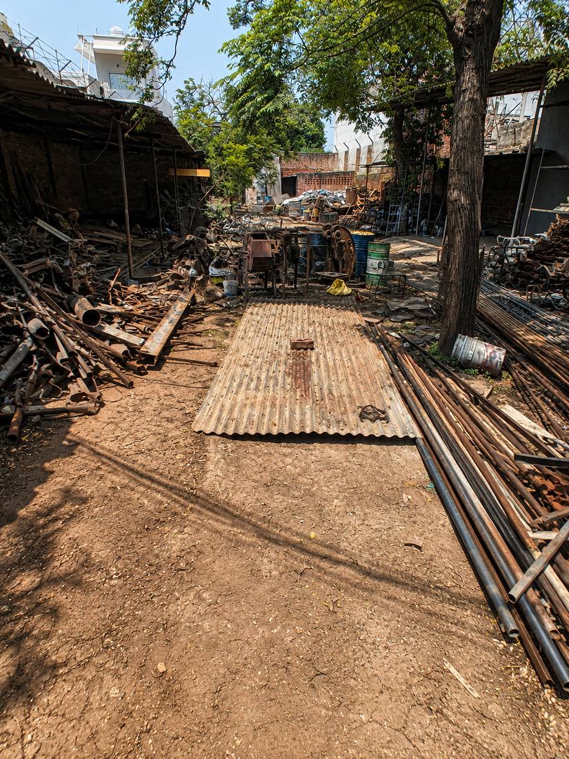 Sorted pipes and rods stacked in Bahl Metals covered storage yard